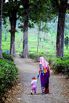 Muslim mother with her daughter at tea farm