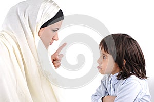 Muslim mother threating her son photo