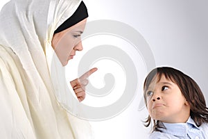 Muslim mother threating her son photo