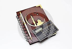 Muslim notebook nwith the pen.