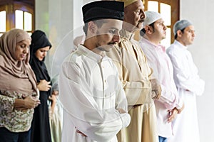 Muslim people praying in mosque