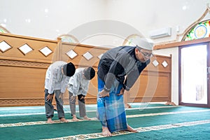 Muslim people praying in the mosque