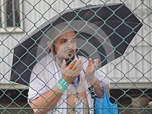 Muslim pilgrims praying on jabal Arafat, HajjHajj pilgrim prayingMuslim man wearing hajj cloth, Mecca, Saudi Arabia, August 10,