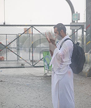 Muslim pilgrims praying on jabal Arafat, HajjHajj pilgrim prayingMuslim man wearing hajj cloth, Mecca, Saudi Arabia, August 10,