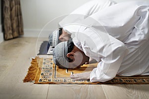 Muslim prayers in Sujud posture photo