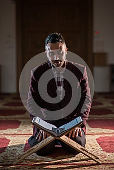 Muslim reading Koran