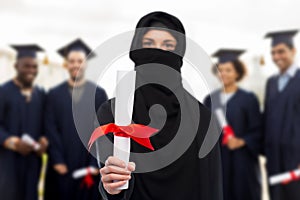 Muslim student woman in hijab with diploma