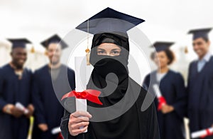 Muslim student woman in hijab with diploma