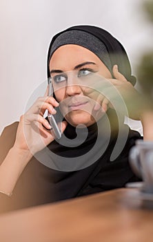 Muslim talking on mobilephone