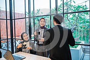 muslim team having conversation during meeting at the office