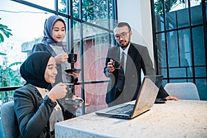 muslim team having conversation during meeting at the office