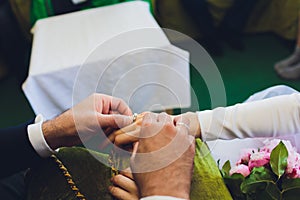 Muslim wedding rite. Bride and groom sitting on the floor in the moqsue. Muslim Wedding prayers. Nikah.