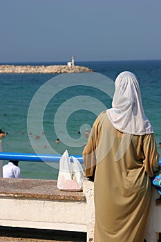 Muslim woman at the beach