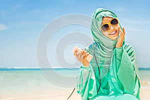 Muslim woman on a beach