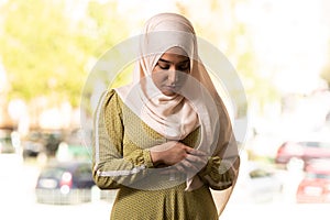 Muslim Woman in Beige Hijab and Traditional Clothes Praying for Allah