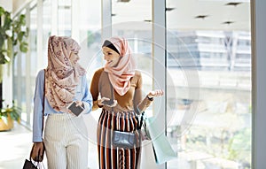 Muslim woman catching up after work