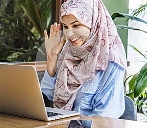 Muslim woman doing a video cal with her friend