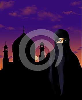 A muslim woman dressed in a niqab is seen in front of a mosque