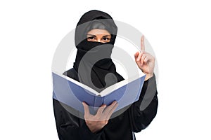 Muslim woman in hijab with book over white