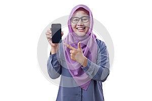 Muslim Woman Looking at Camera Smiling and Shows Smart Phone, Phone Mock Up