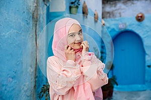 Tourist on a blue street in Chefchaouen, Morocco