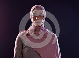 Muslim woman, portrait and hijab in faith for religion, islam or praise against a dark studio background. Face of