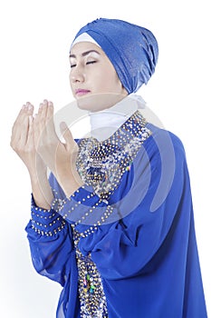 Muslim woman with pray gesture