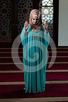 Muslim Woman Is Praying in the Mosque