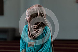 Muslim Woman Is Praying in the Mosque