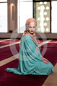 Muslim Woman Is Praying in the Mosque