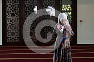 Muslim Woman Is Praying in the Mosque