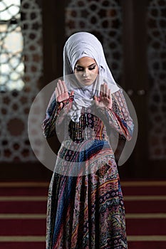 Muslim Woman Praying in Mosque