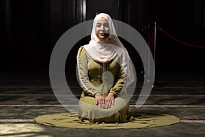 Muslim Woman Praying at the Mosque