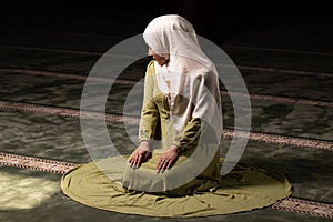 Muslim Woman Praying at the Mosque