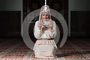 Muslim Woman Is Praying In The Mosque