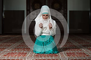 Muslim Woman Praying In Mosque