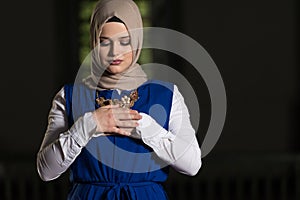 Muslim Woman Praying In Mosque