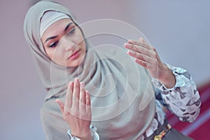 Muslim woman praying in mosque