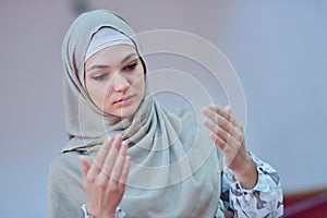 Muslim woman praying in mosque