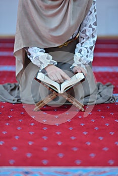 Muslim woman praying in mosque