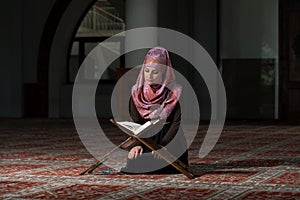 Muslim Woman Reading The Koran