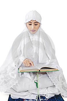 Muslim woman reads Kuran 2 photo