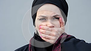 Muslim woman showing lack of freedom of choice and speech