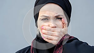 Muslim woman showing lack of freedom of choice and speech