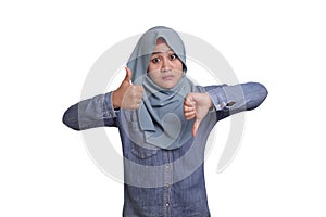 Muslim woman shows thumbs up and down gesture