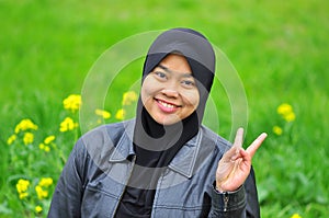 A muslim woman smiles in spring season