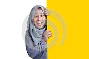 Muslim Woman Smiling Behind Blank White Board