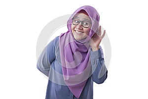 Muslim Woman Smiling While Doing Hearing Gesture