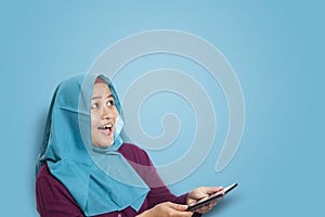 Muslim Woman Surprised to See Something Above when using Phone