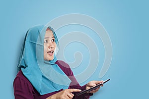 Muslim Woman Surprised to See Something Above when using Phone